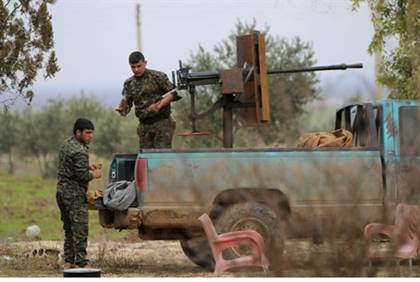 Kurdish YPG fighters on the frontline against ISIS in Ras al-Ain northern Syira - Reuters